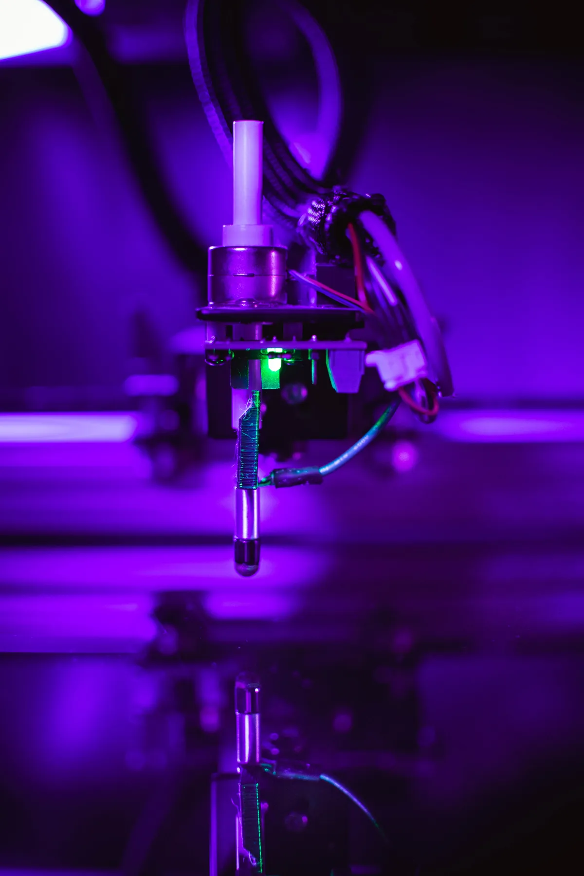 Close-up of the robot stylus tip and its status LED