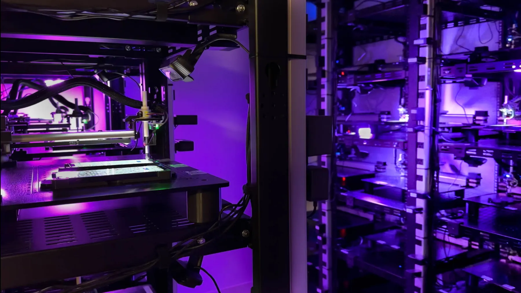 A Mobot lab: an open robot bay and a rack of robot cells, each holding a phone